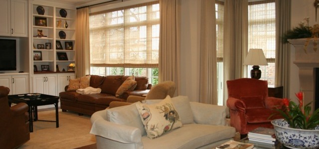 Linen draperies on iron rods. Hunter Douglas Provenence roman shades for sun and privacy.